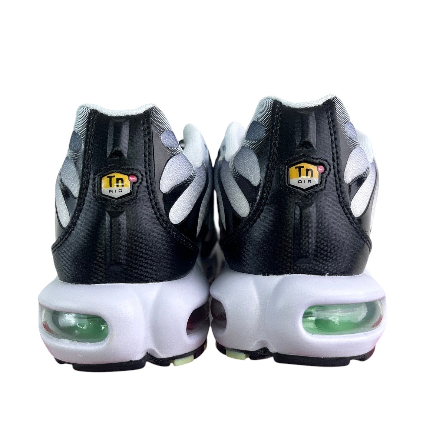 Luxury Chef Nike TN Air sneakers with black, white, and grey gradient uppers and green air cushioning.