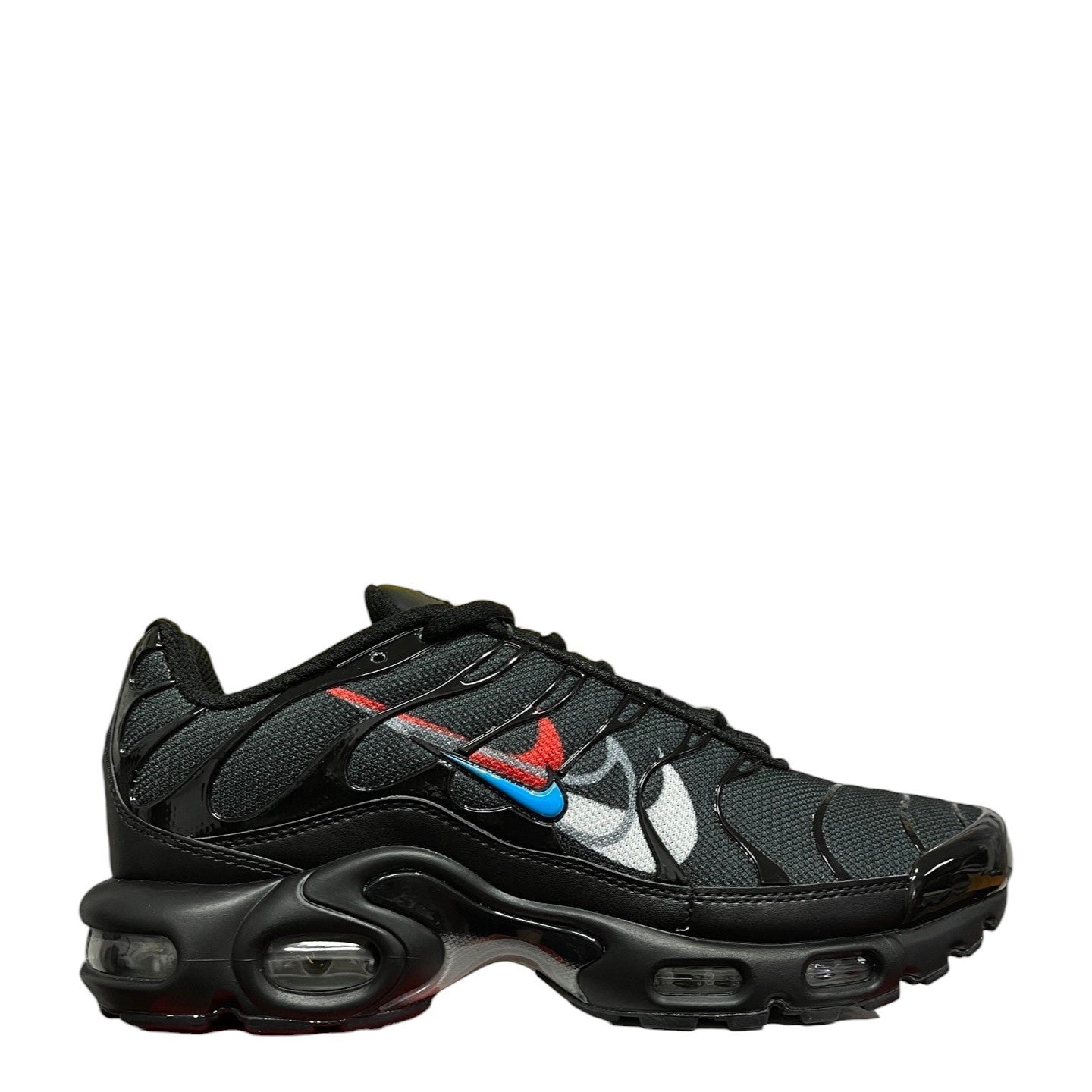 Luxury Chef Nike Air Max Plus TN black sneakers with red, blue, and white accents. Mesh and patent leather.