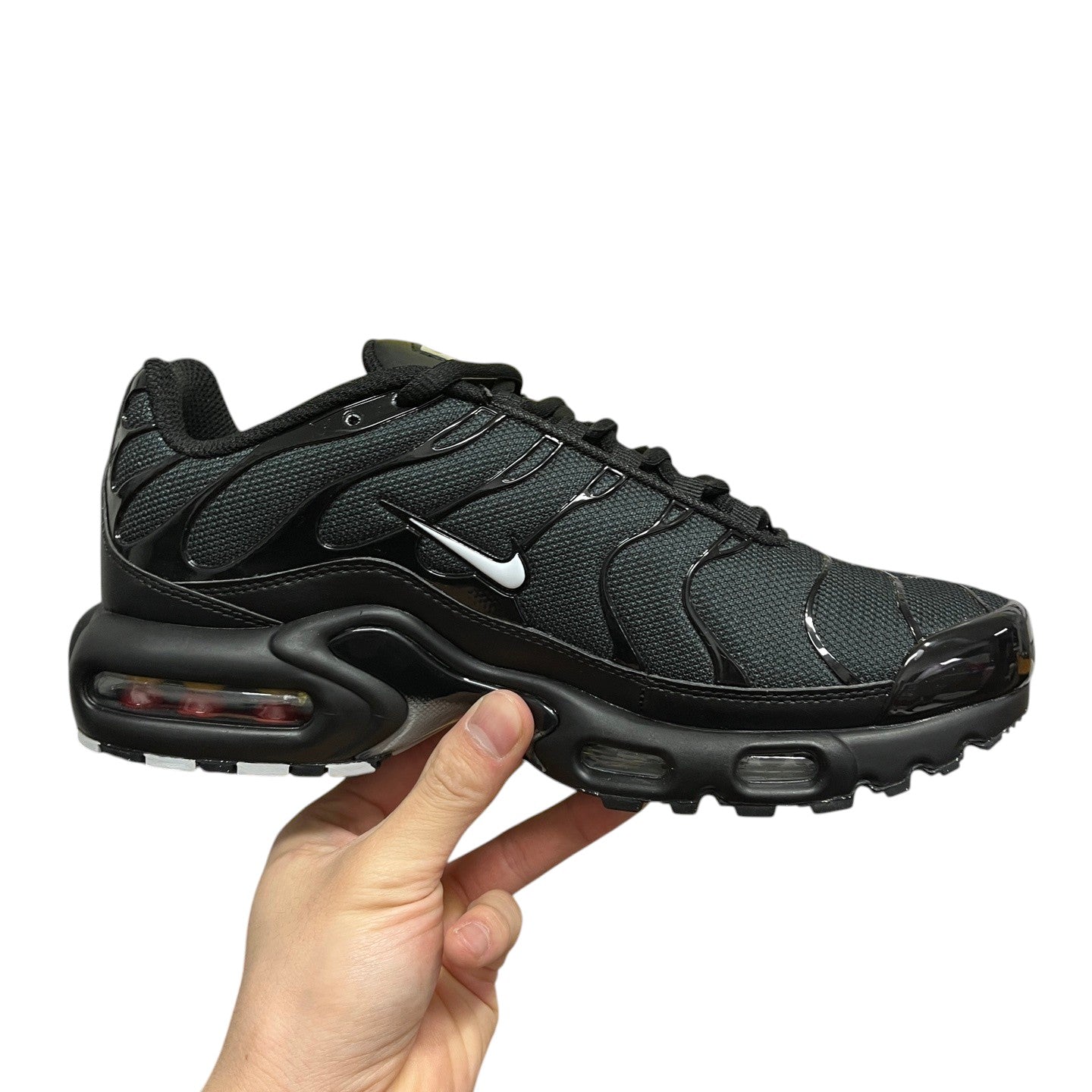 Luxury Chef Nike TN black mesh sneakers with white swoosh logo and visible air cushioning.