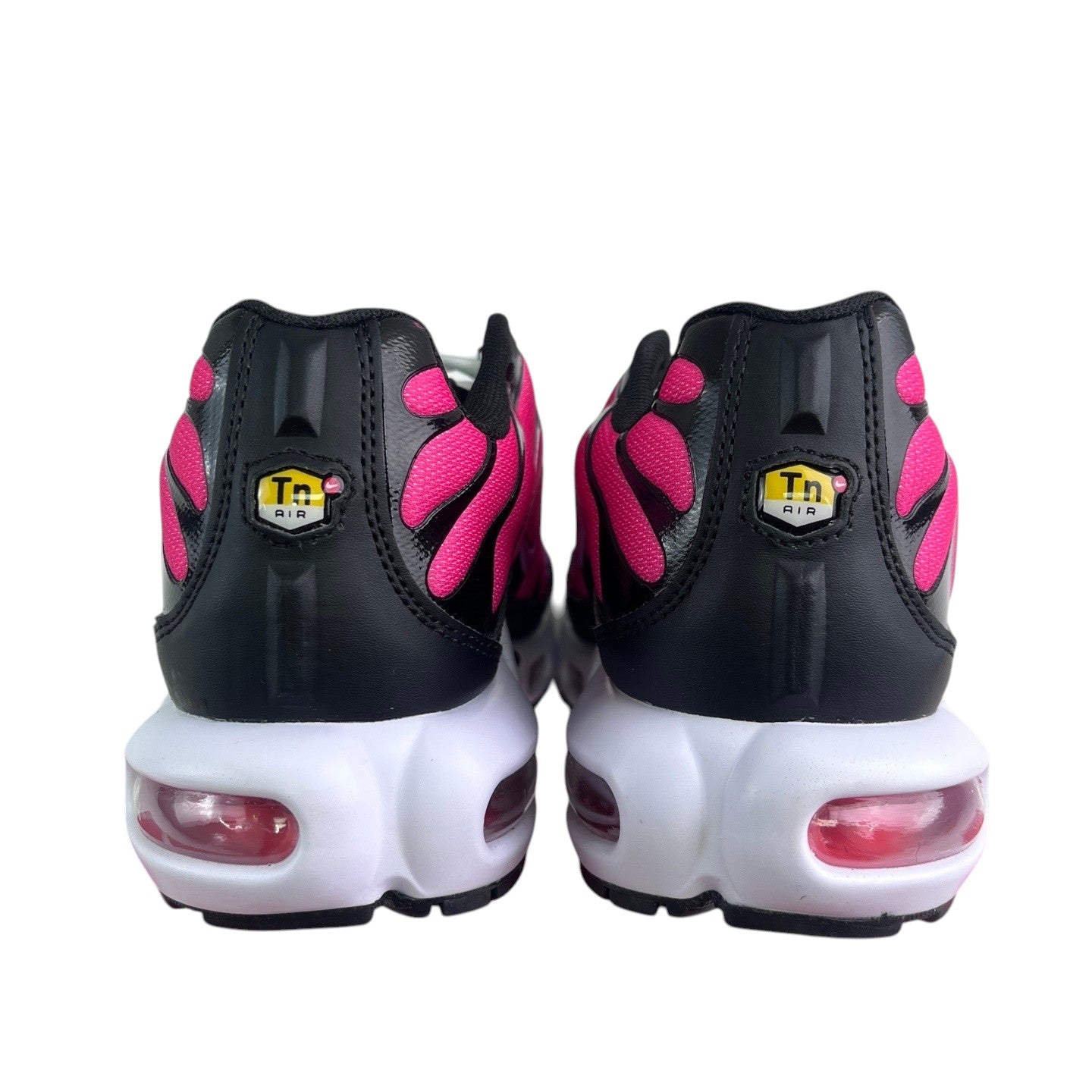 Luxury Chef Nike TN sneakers with black and bright pink accents, featuring visible air cushioning.