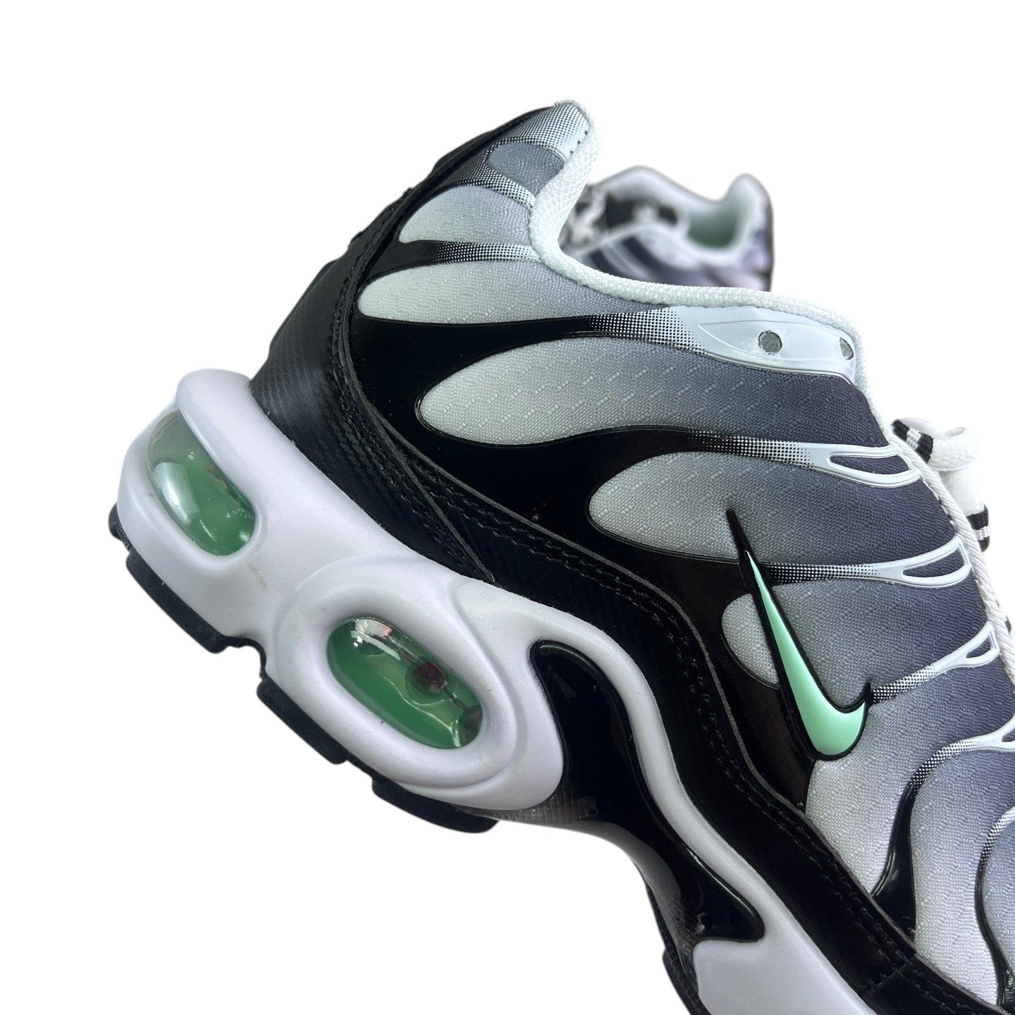 Luxury Chef Nike TN sneakers with black, grey, and white gradient upper and mint green accents. Features visible air cushioning.