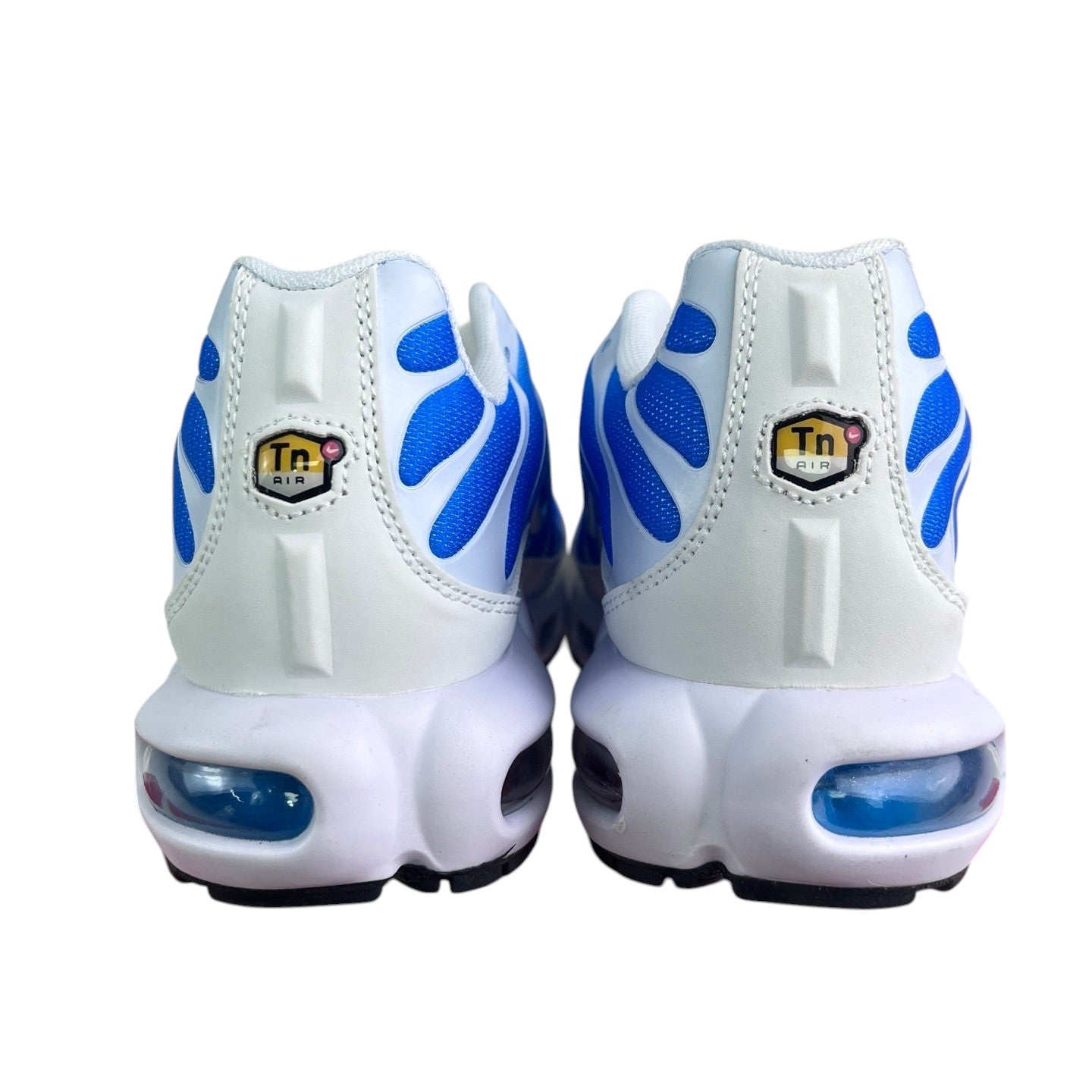 Luxury Chef Nike TN sneakers with white leather and blue wave accents. Features visible air cushioning.