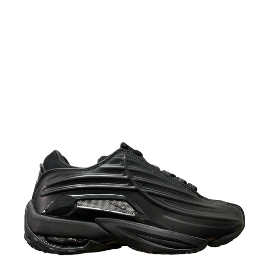 Luxury Chef NOCTA HOT STEP II black sneakers with metallic silver accents and cushioned sole.