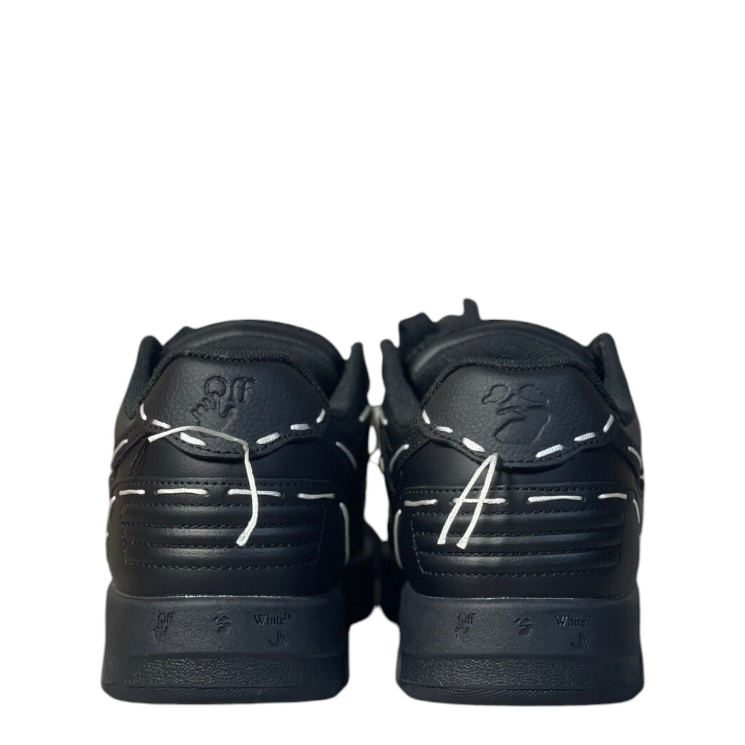 Luxury Chef Off-White Out Of Office black leather sneakers with white stitching details and embossed logo.