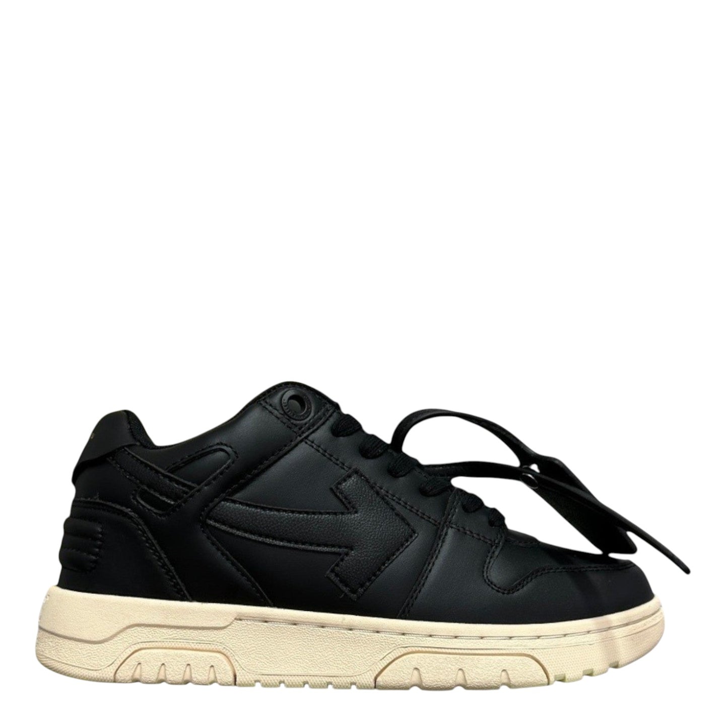 Luxury Chef Off-White Out of Office black leather low-top sneakers with a cream sole and signature zip tie detail.