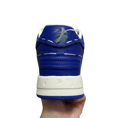 Luxury Chef OFF-WHITE OUT OF OFFICE blue leather sneakers with white stitching and green graphic detail.