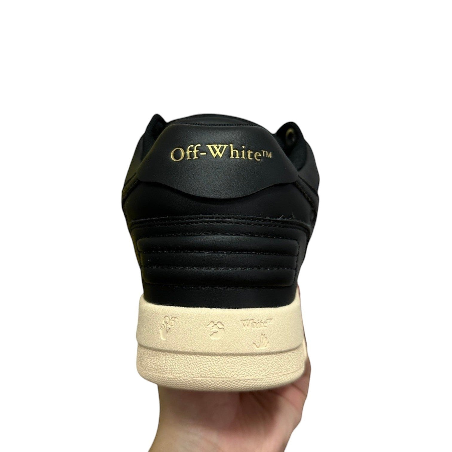 Luxury Chef OFF-WHITE OUT OF OFFICE black leather sneakers with gold branding and signature motifs on the sole.
