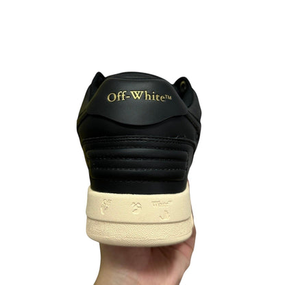 Luxury Chef OFF-WHITE OUT OF OFFICE black leather sneakers with gold branding and signature motifs on the sole.
