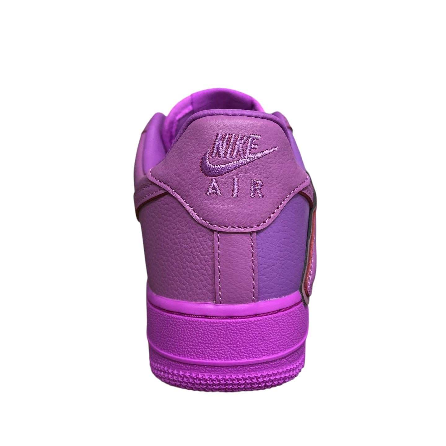 Luxury Chef Nike Air Force 1 CPFM sneakers in purple leather with contrasting purple panels and embroidered Nike Air logo.