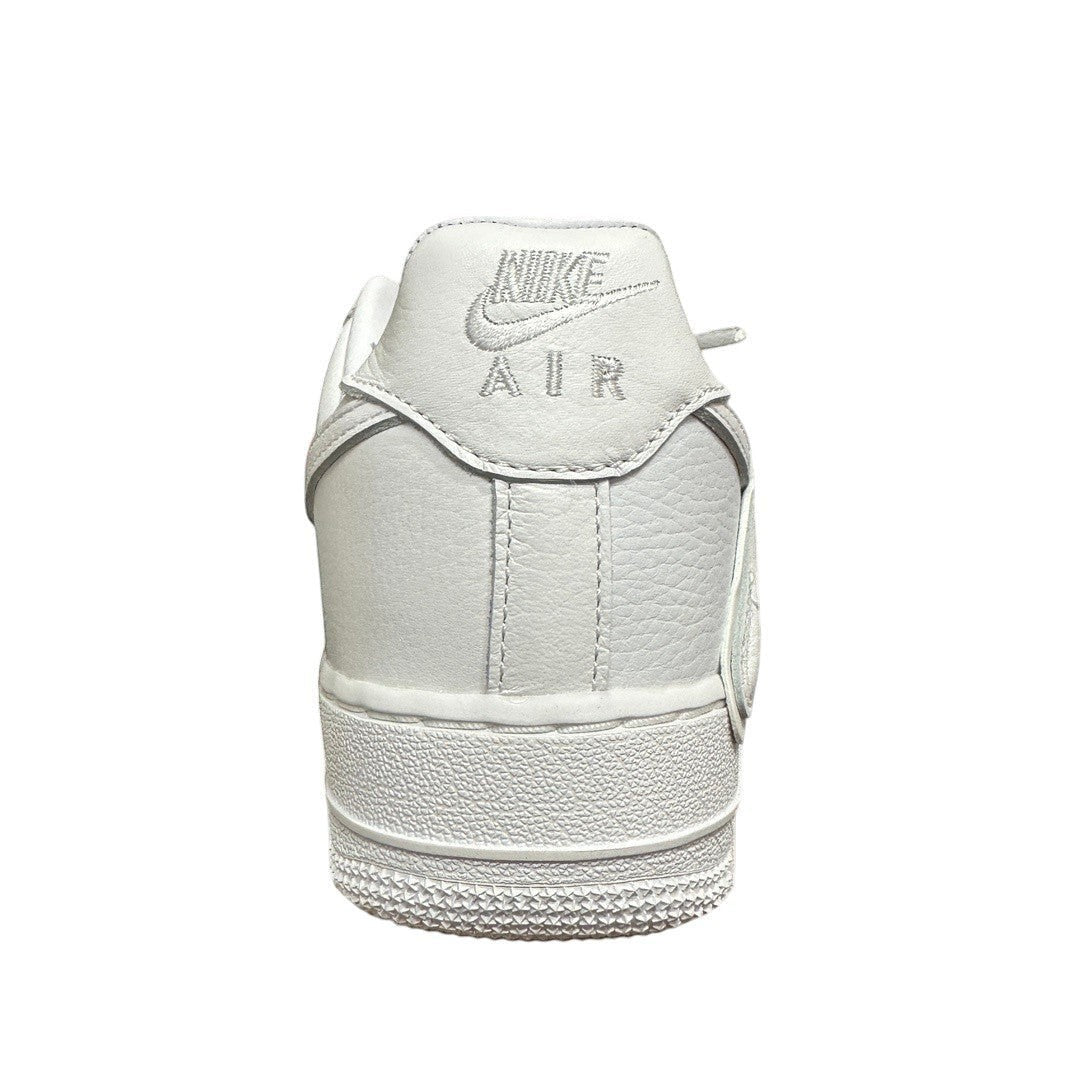Luxury Chef white leather Nike Air Force 1 CPFM sneakers with embroidered logo and textured sole.