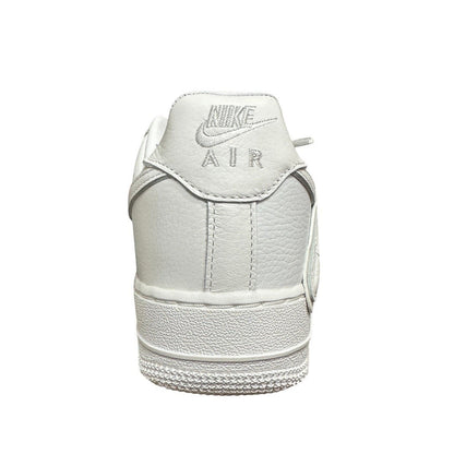Luxury Chef white leather Nike Air Force 1 CPFM sneakers with embroidered logo and textured sole.