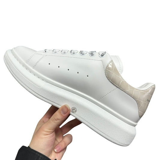 Luxury Chef white leather sneakers with crocodile-embossed heel detail and thick white sole.