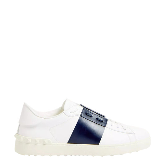 Luxury Chef white leather sneakers with navy blue stripe and signature stud detailing on the sole.