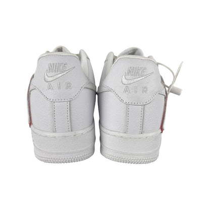 Luxury Chef white leather Nike Air Force 1 CPFM sneakers with red accents on the heel tab.