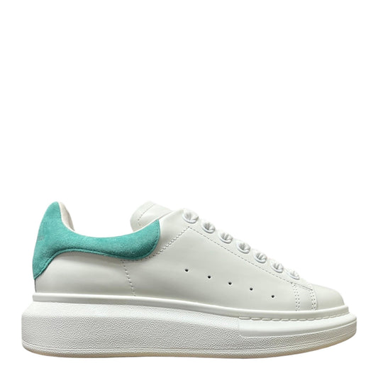 Luxury Chef white leather sneakers with teal suede heel tab and thick white sole.