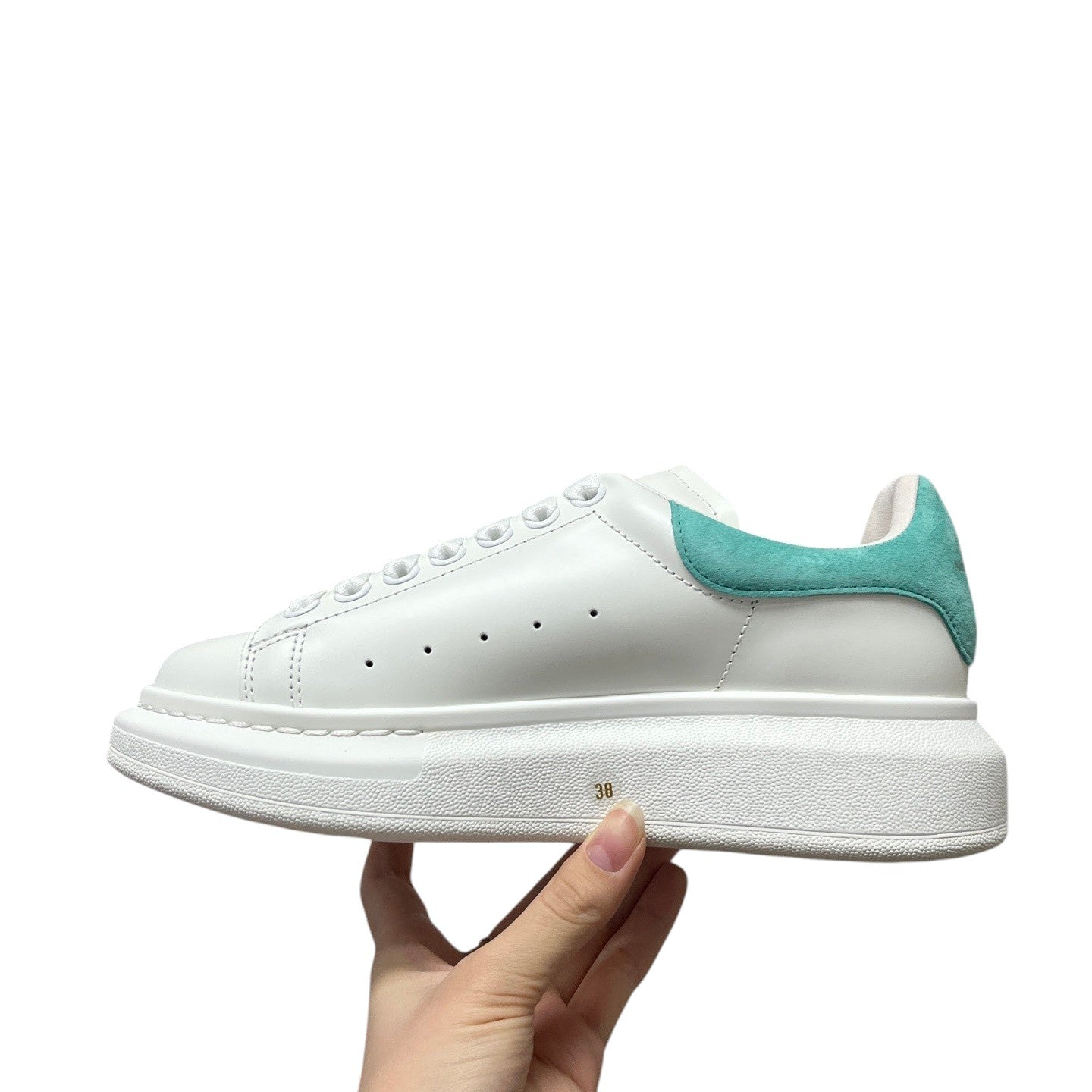 Luxury Chef white leather sneakers with turquoise suede heel tab and platform sole. Classic design with perforated details.
