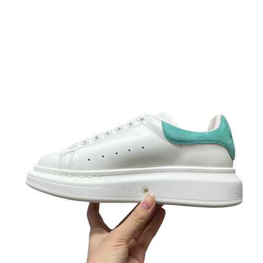 Luxury Chef white leather sneakers with turquoise suede heel tab and platform sole. Classic design with perforated details.