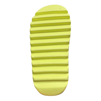 Luxury Chef YEEZY SLIDE in bright yellow, featuring a textured sole for grip. Modern slip-on design.